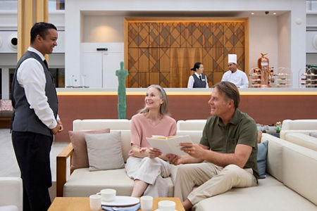 Couple seated in modern cafe lounge