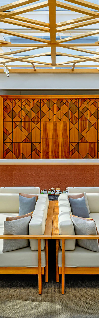 Modern lounge with intricate wooden ceiling design