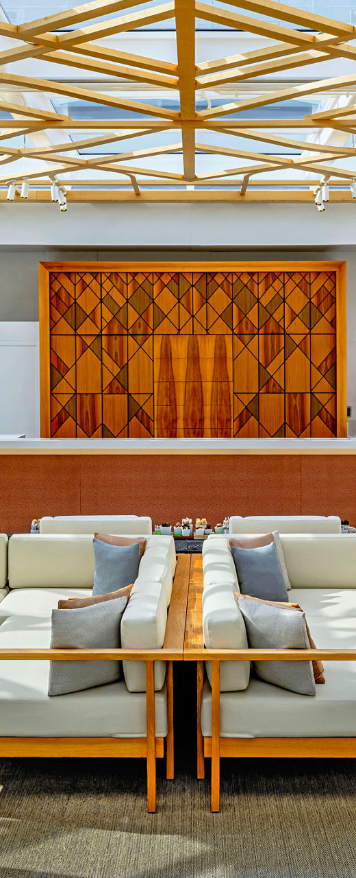 Modern lounge with intricate wooden ceiling design