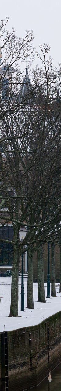 Snowy canal with historic architecture