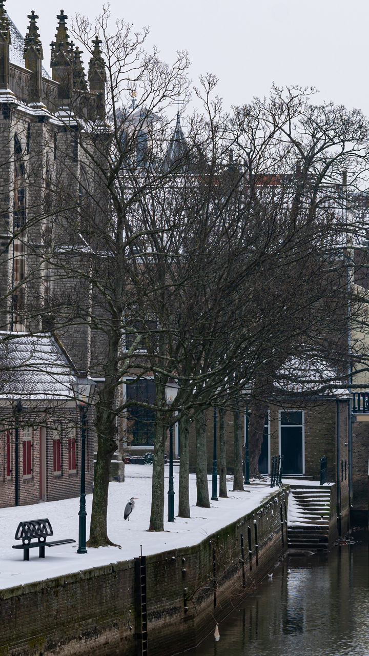 Snowy canal with historic architecture