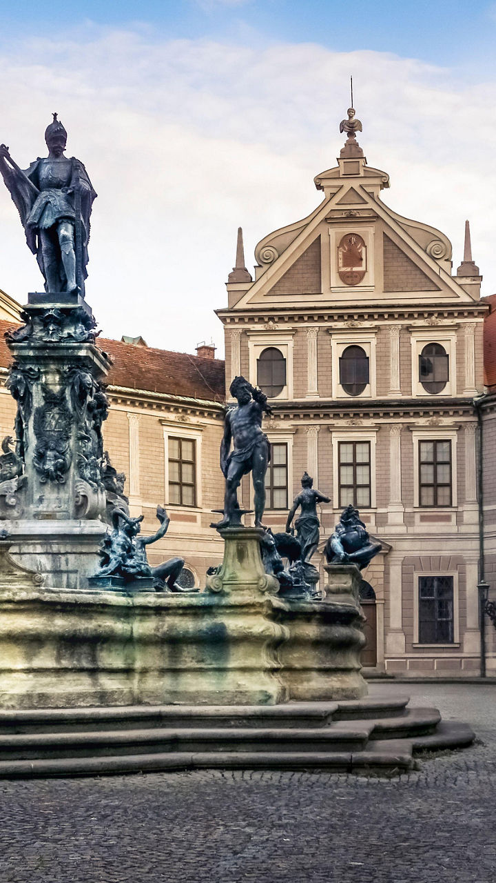Historic courtyard fountain with classical statues