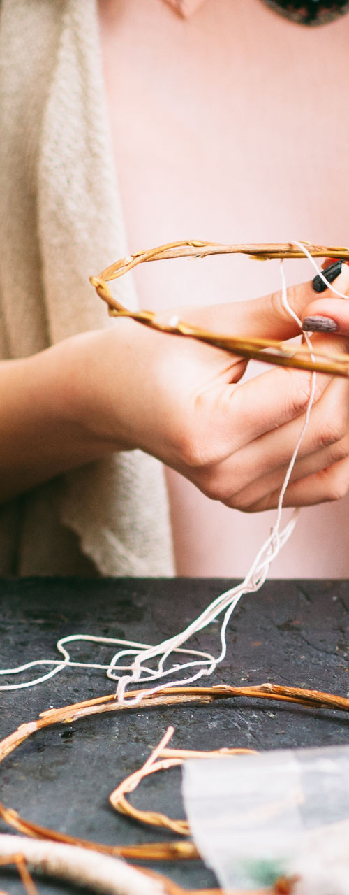 Woman crafting handmade dreamcatchers