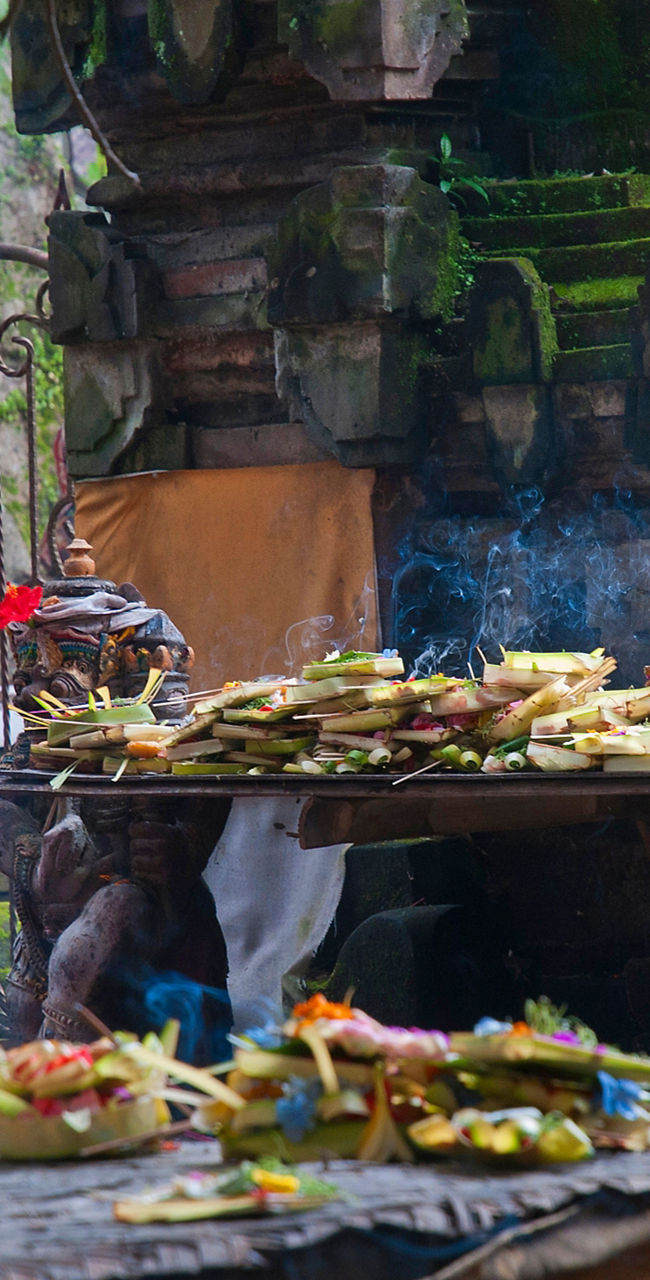 Woman Praying at Traditional Balinese Temple