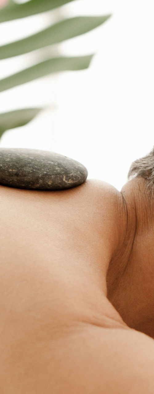 Relaxing hot stone massage therapy session