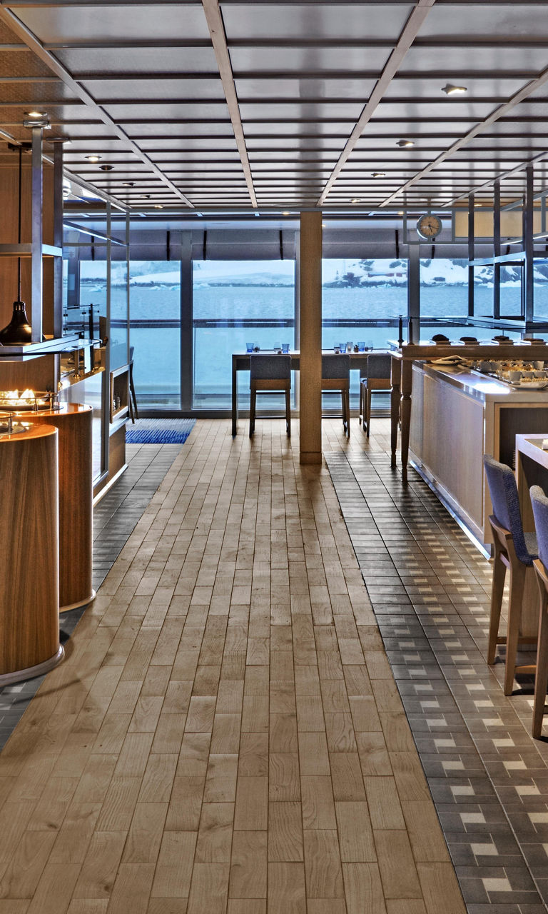 Modern waterfront dining area with buffet setup