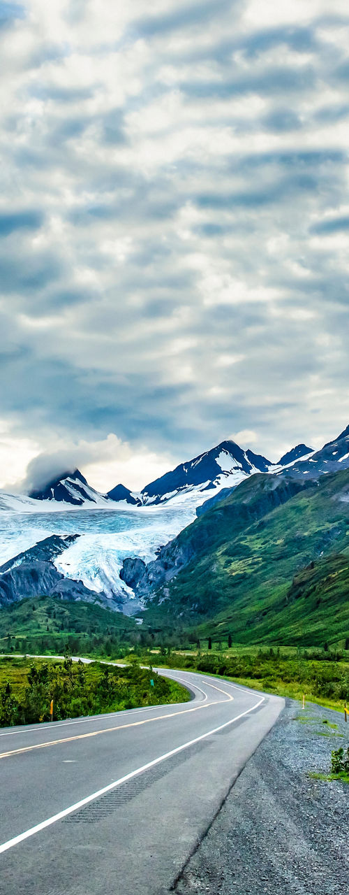 Scenic mountain road with glacier views