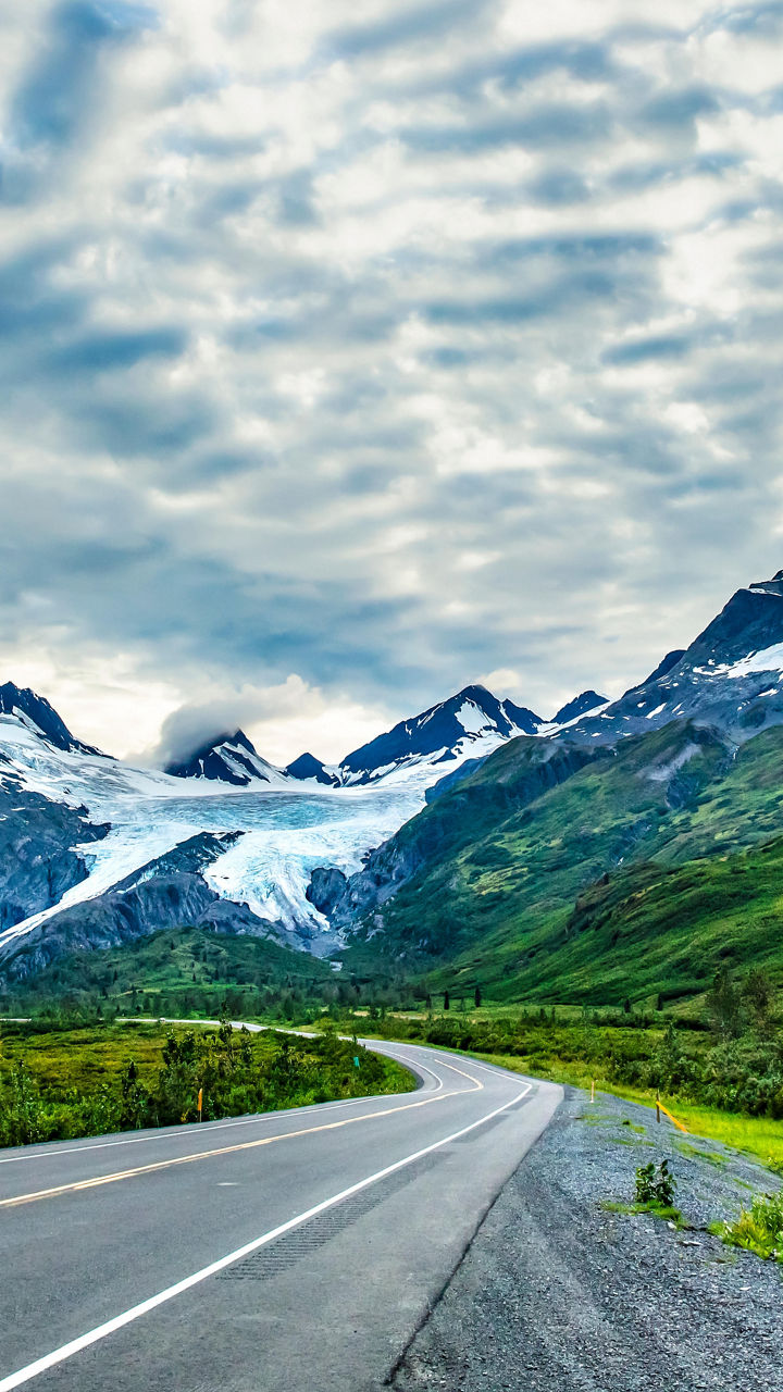 Scenic mountain road with glacier views