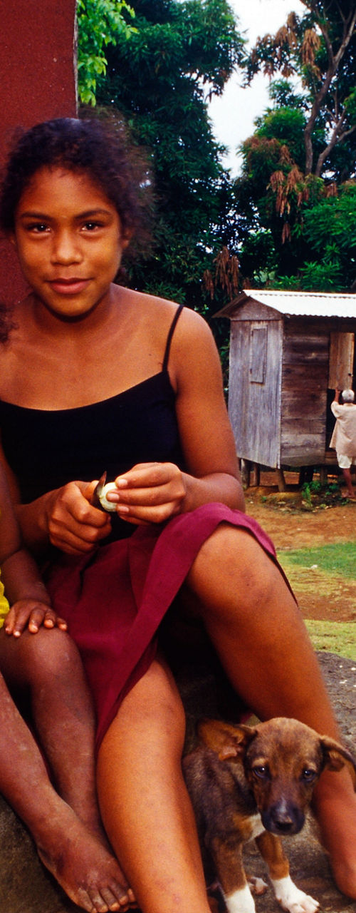 Rural family sitting with small dog
