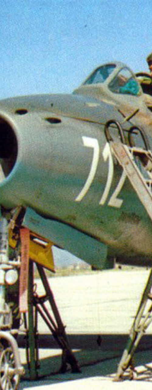 Military aircraft maintenance with crew outdoors
