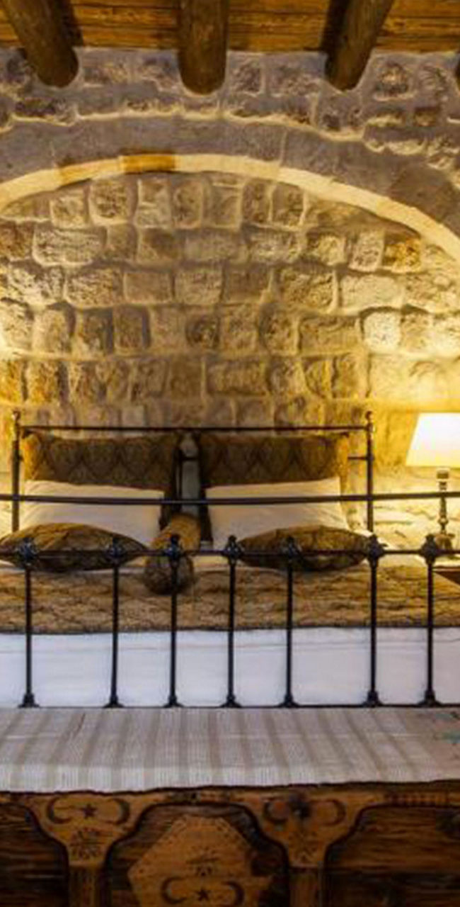 Rustic stone bedroom with warm lighting