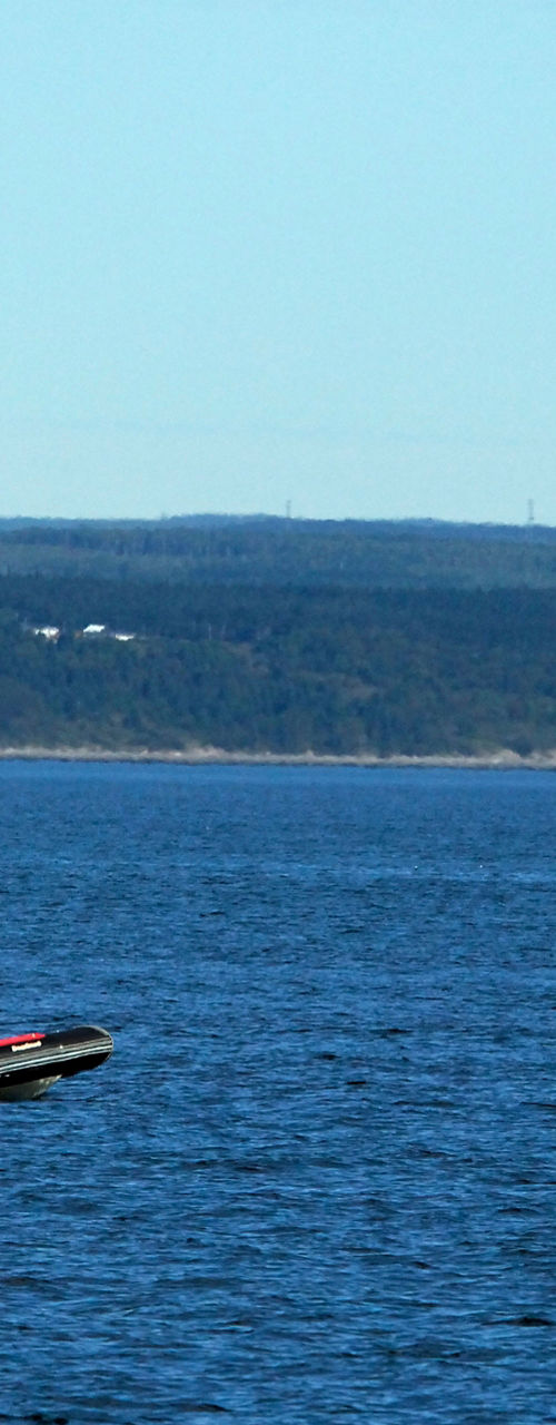 Group on inflatable boat in open water