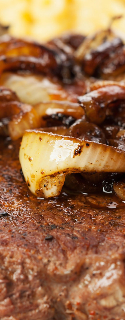Grilled steak with caramelized onions
